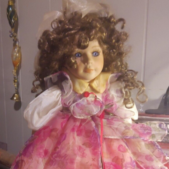 Porcelain-Standing-Doll-With-Curly-Brown-Hair.png